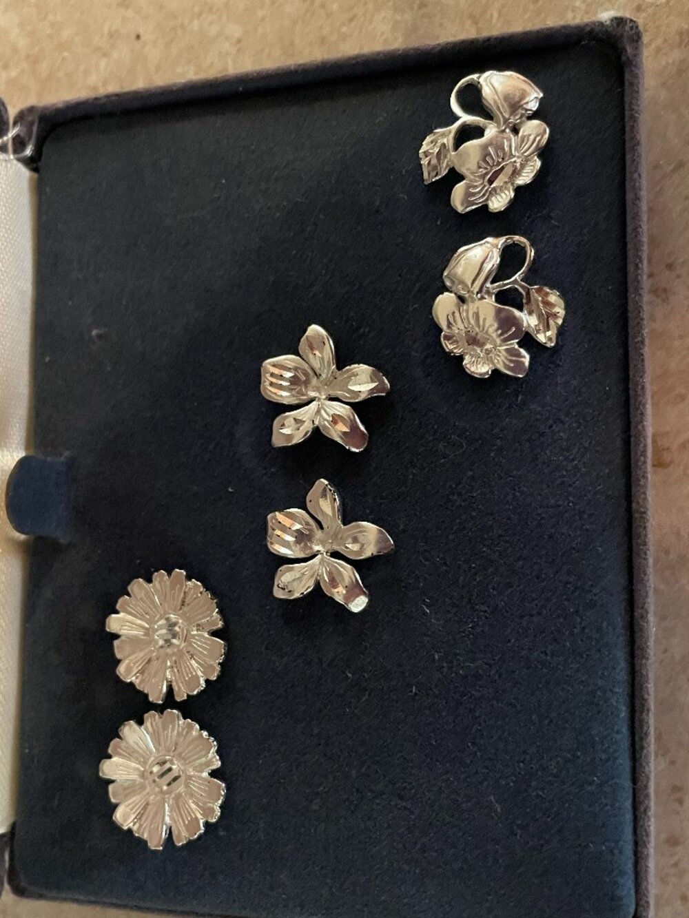 Brand new , 3 pairs of sterling silver flower earrings